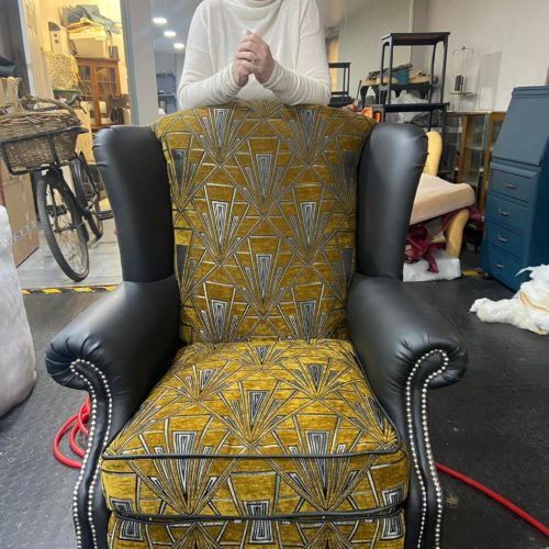 lady at class with upholstered chair